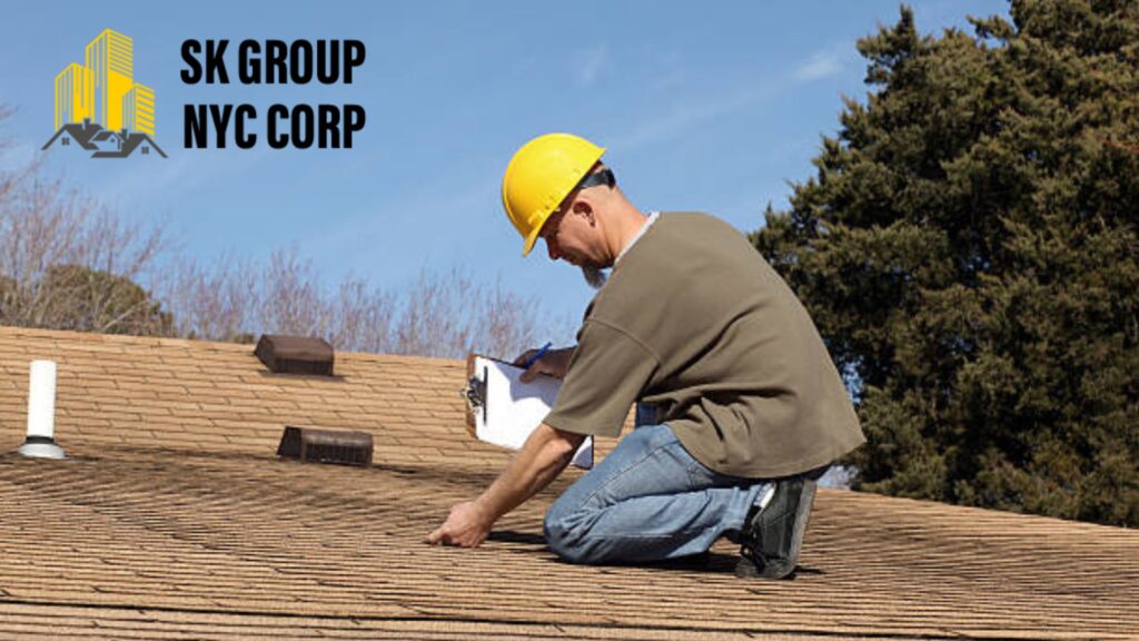A construction worker wearing a yellow hard hat inspecting a residential roof with a clipboard, representing SK Group NYC Corp's roofing services.
