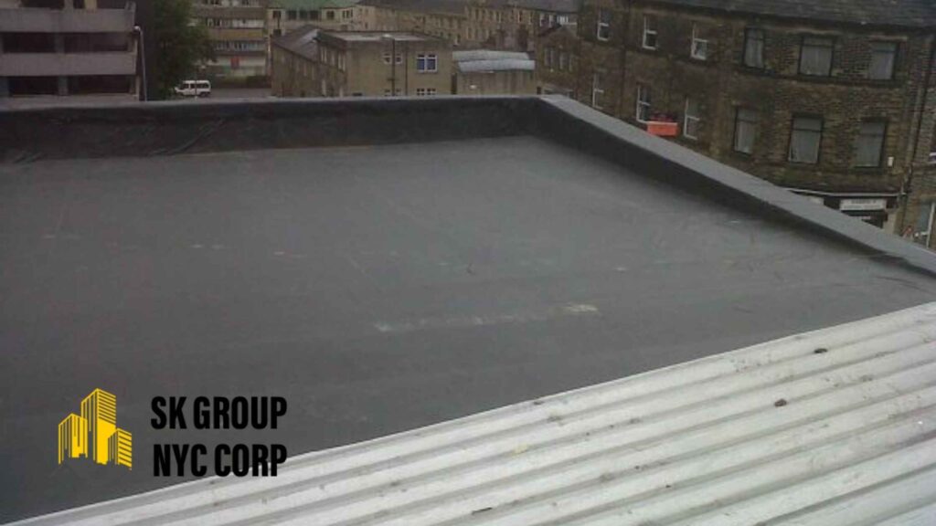 Professional rubber roofing installation on a flat roof in New York City, ensuring waterproof protection and long-lasting durability.