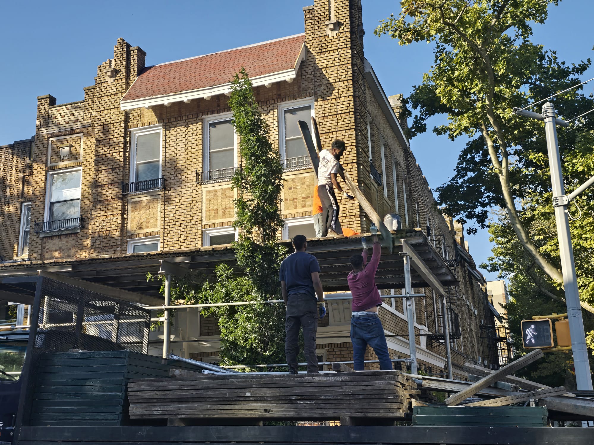 Technician repairing parapet damage, safeguarding your building from leaks and ensuring its strength and safety.