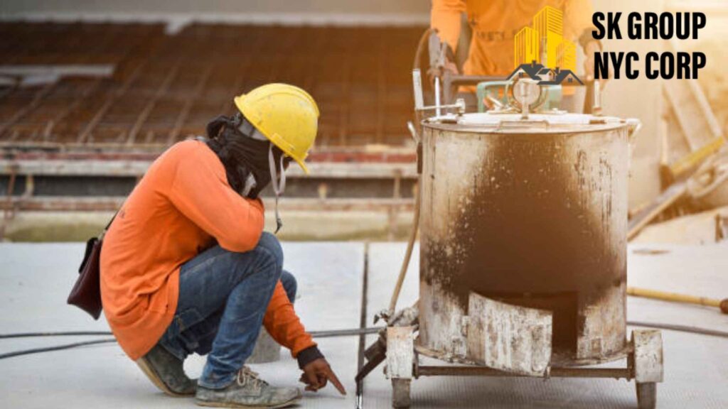 Worker performing concrete crack repair in NYC with professional tools – SK Group NYC Corp.