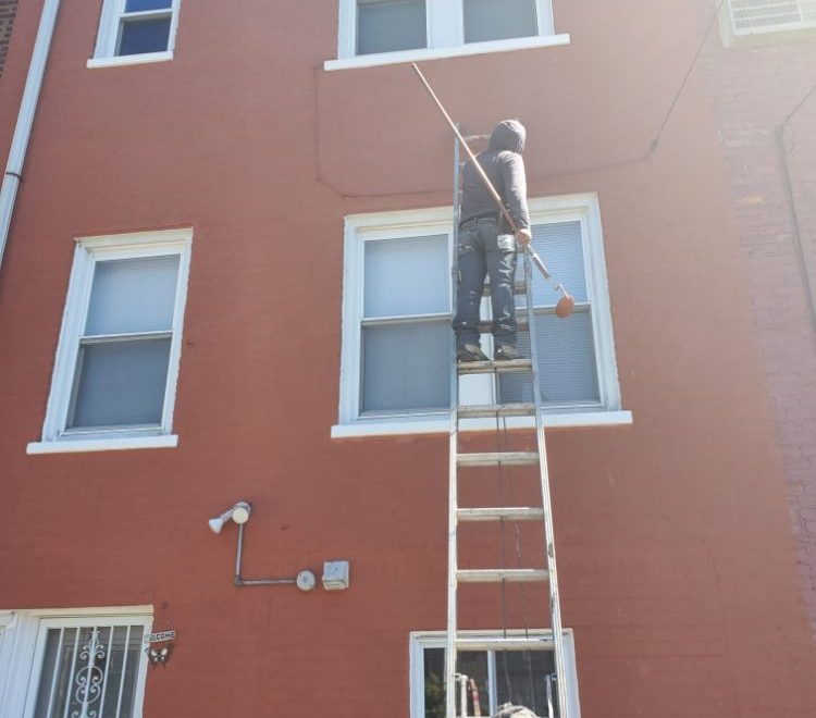 An image showing a home being exterior waterproofed, highlighting the process of creating a dry, leak-free living space.