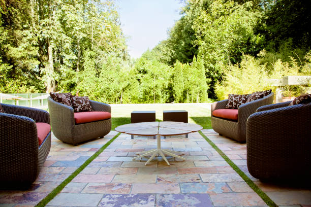 beautifully constructed porch with outdoor seating area surrounded by greenery