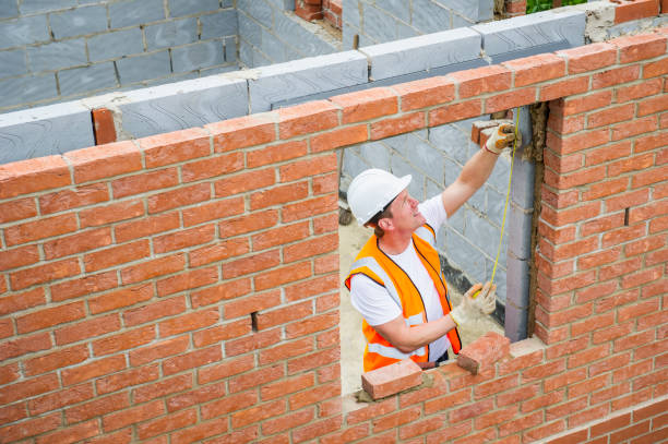 mason laying bricks or restoring a brownstone