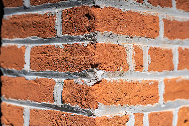 Close-up of fresh tuckpointing mortar on brick wall showing clean restoration