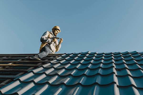 roofing services in NYC by expert roofers installing metal roofing for weather protection
