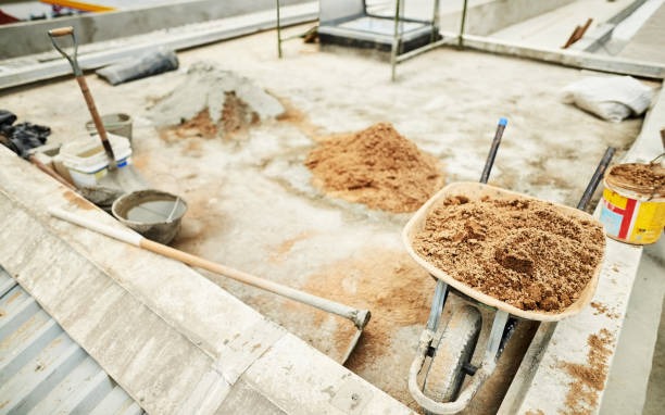 Flat roof installation with construction materials and tools on rooftop