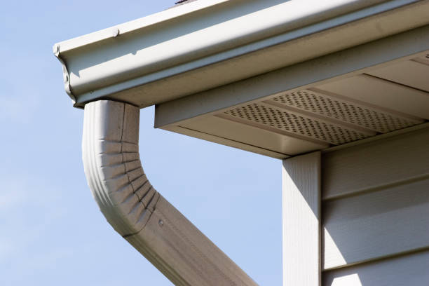 gutter downspout installation on house exterior