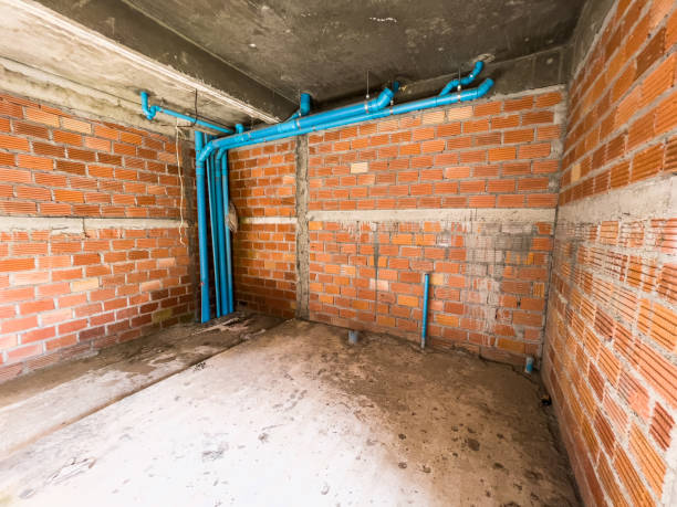 Interior basement drainage system with blue pipes for water control