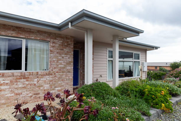 Exterior of a house with newly installed brick siding and modern design elements