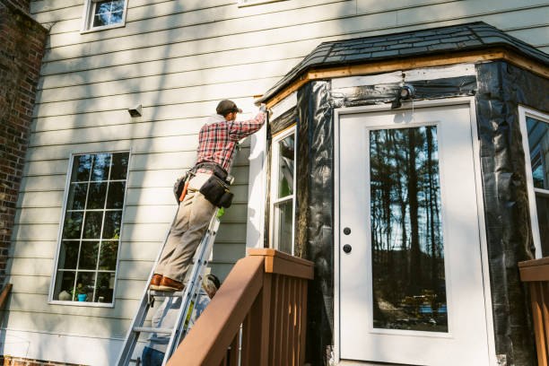 Professional vinyl siding installation on a residential NYC home exterior